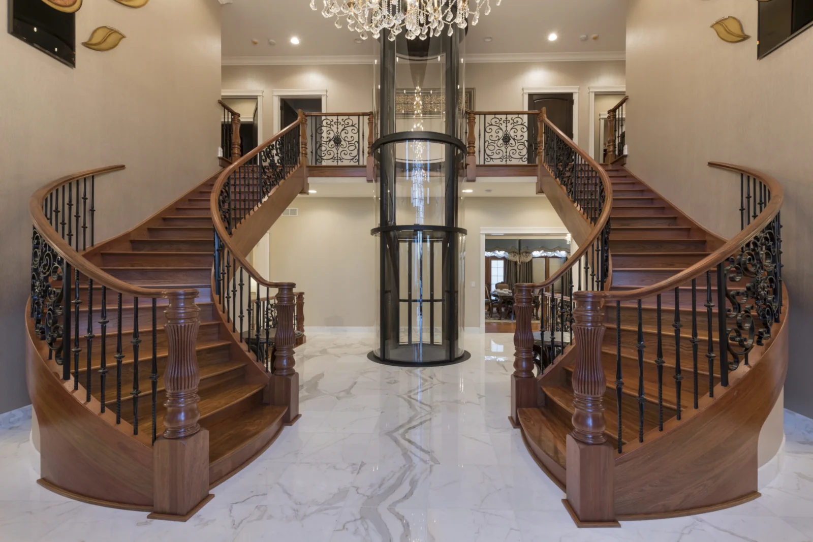 Savaria Vuelift panoramic glass home elevator with red frame in modern luxury home